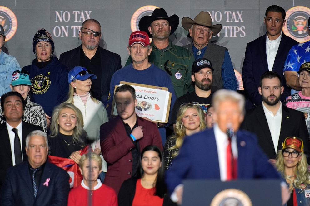 PHOTO: Oath Keepers founder Stewart Rhodes, top row at second left, listens as President Donald Trump speaks about the economy during an event at the Circa Resort and Casino in Las Vegas, Jan. 25, 2025. 
