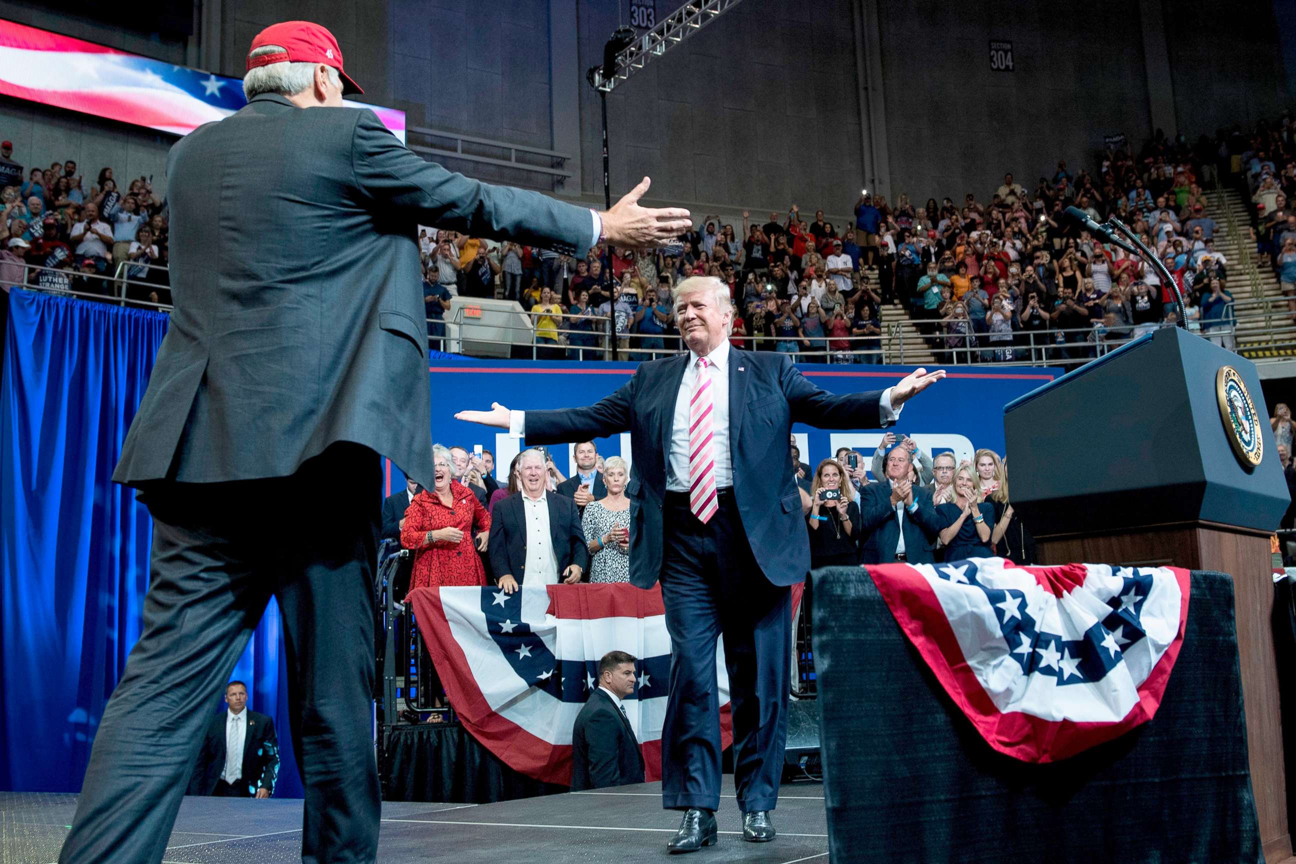 PHOTO: Alabama state Republican Senator Luther Strange, left, walks to embrace President Donald Trump during the senator's rally at the Von Braun Civic Center September 22, 2017 in Huntsville, Ala.