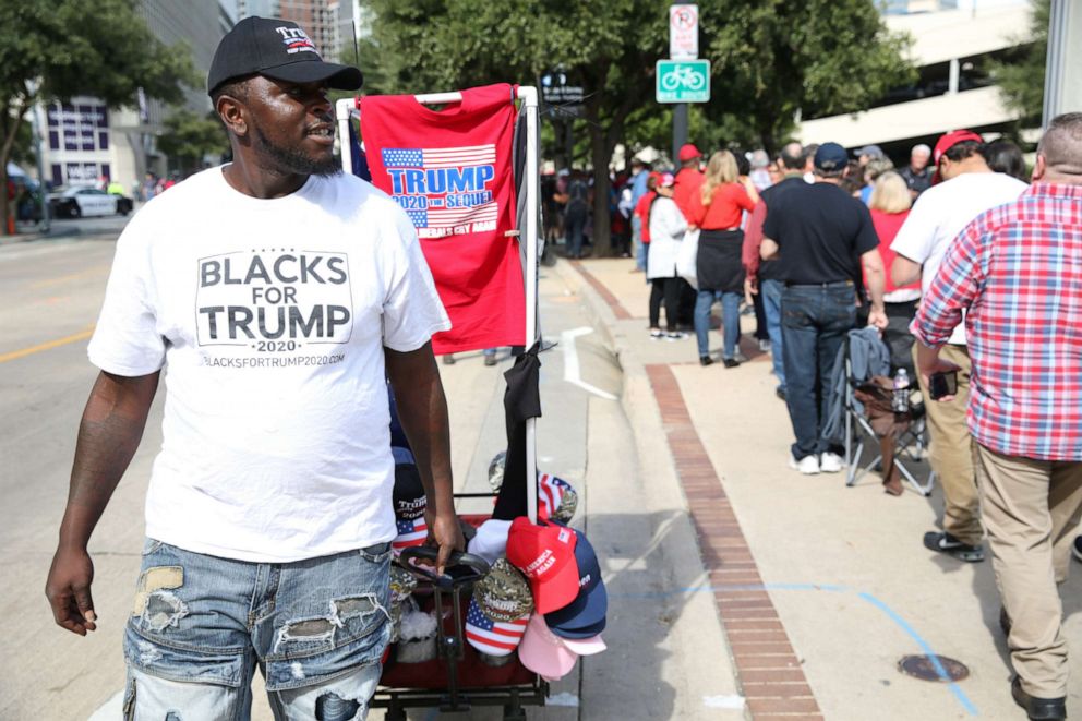 PHOTO: A vendor wears a campaign t-shirt that reads "Blacks For Trump" outside a rally with U.S. President Donald Trump in Dallas, Texas, U.S., on Thursday, Oct. 17, 2019.