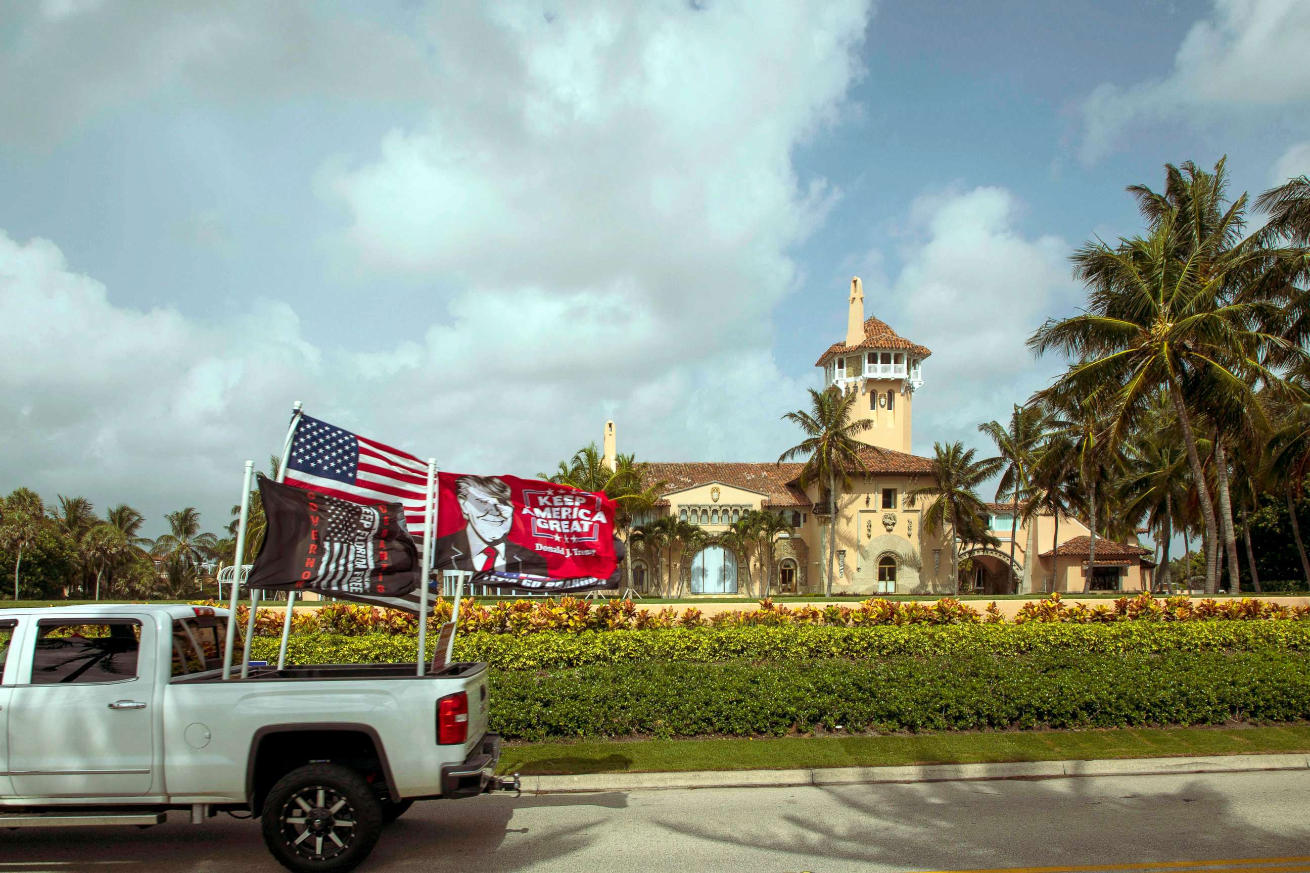 PHOTO: A truck displaying pro-Trump flags is dirven past Mar-a-Lago in Palm Beach, the home of former President Donald Trump, Aug. 9, 2022, one day after FBI agents searched the residence.