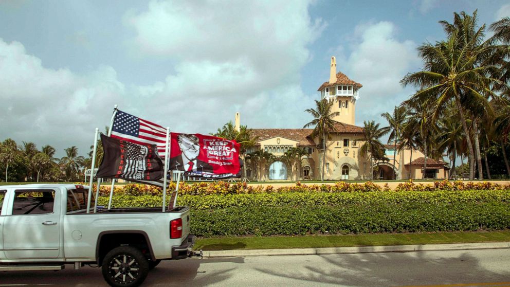 PHOTO: A truck displaying pro-Trump flags is dirven past Mar-a-Lago in Palm Beach, the home of former President Donald Trump, Aug. 9, 2022, one day after FBI agents searched the residence.
