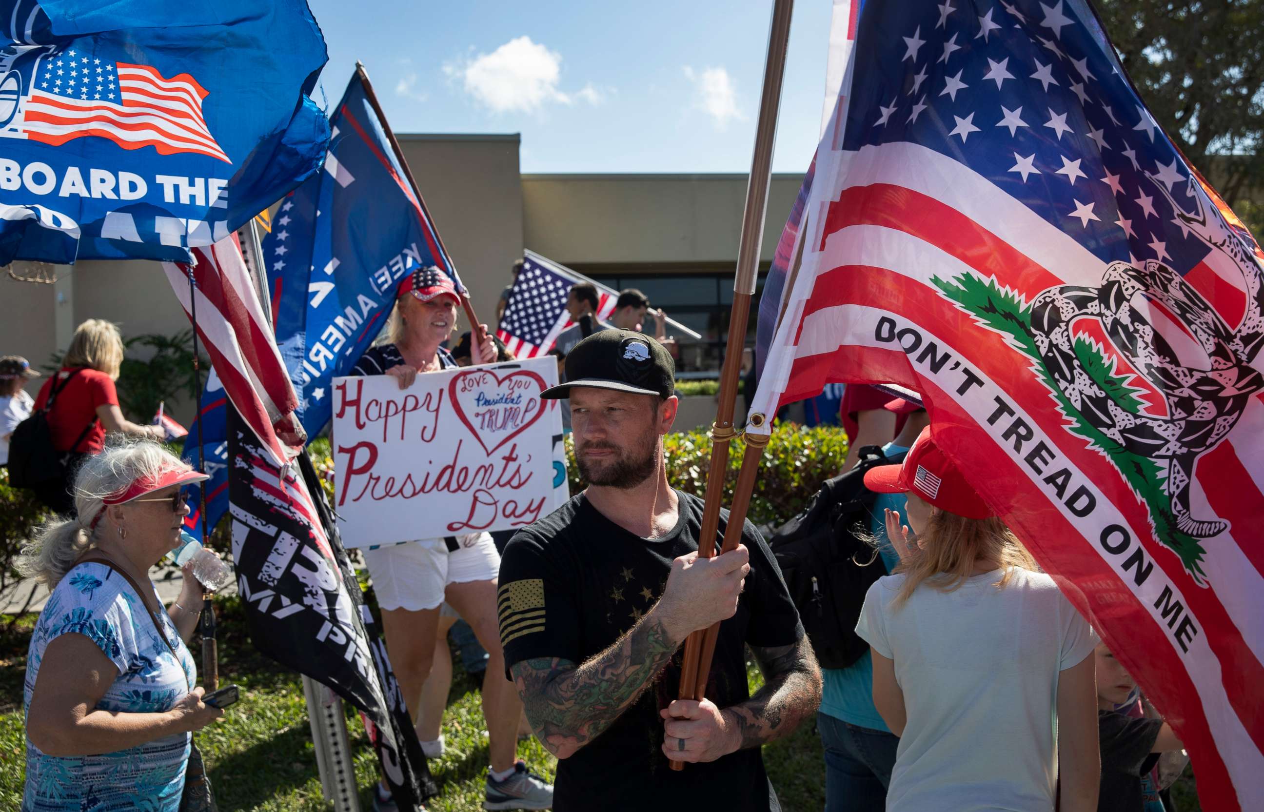PHOTO: Supporters of former President Donald Trump gather along Southern Blvd near Trump's Mar-a-Lago home on Feb. 15, 2021, in West Palm Beach, Fla.