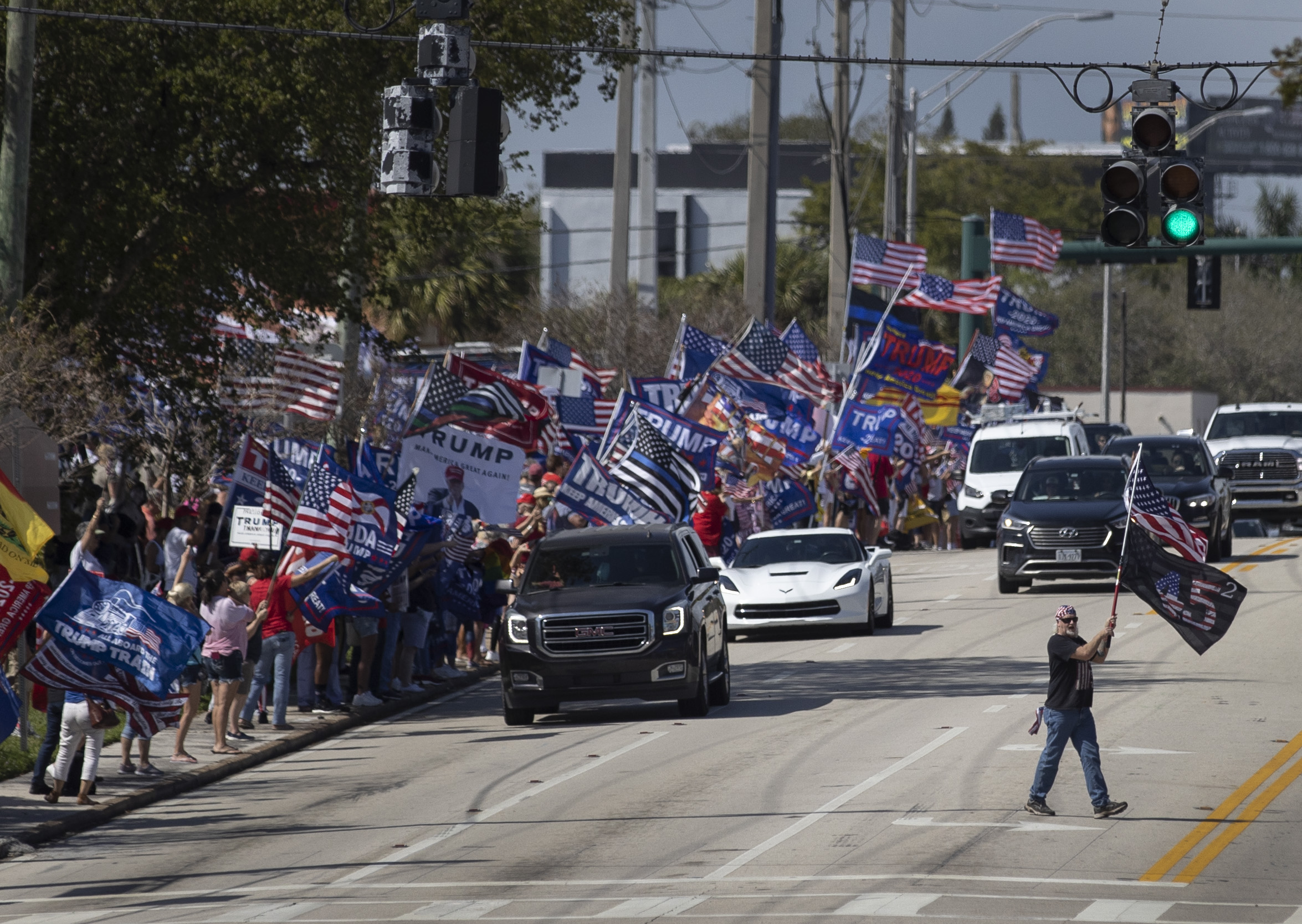PHOTO: Supporters of former President Donald Trump gather along Southern Blvd near Trump's Mar-a-Lago home on Feb. 15, 2021, in West Palm Beach, Fla.