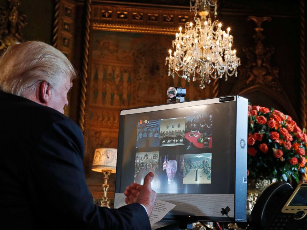 PHOTO: President Donald Trump speaks with members of the armed forces via video conference at his private club, Mar-a-Lago, on Thanksgiving, Nov. 23, 2017, in Palm Beach, Fla.