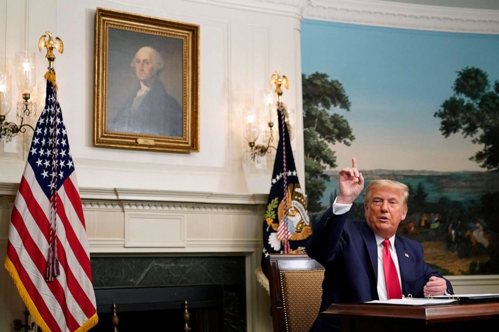 PHOTO: President Donald Trump speaks with reporters after participating in a video teleconference call with members of the military on Thanksgiving, Thursday, Nov. 26, 2020, at the White House in Washington. (AP Photo/Patrick Semansky)