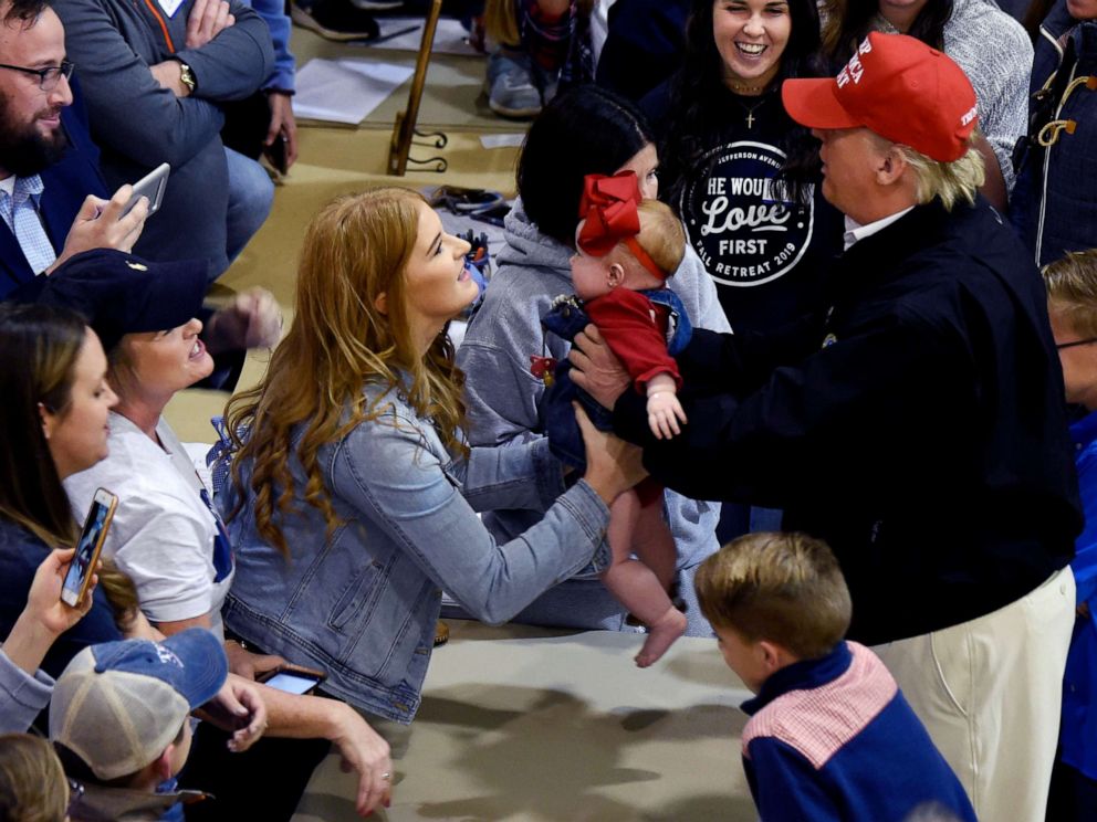 PHOTO: President Donald Trump holds a baby during a visit to tornado-ravaged Putnam County, Tenn., March 6, 2020.