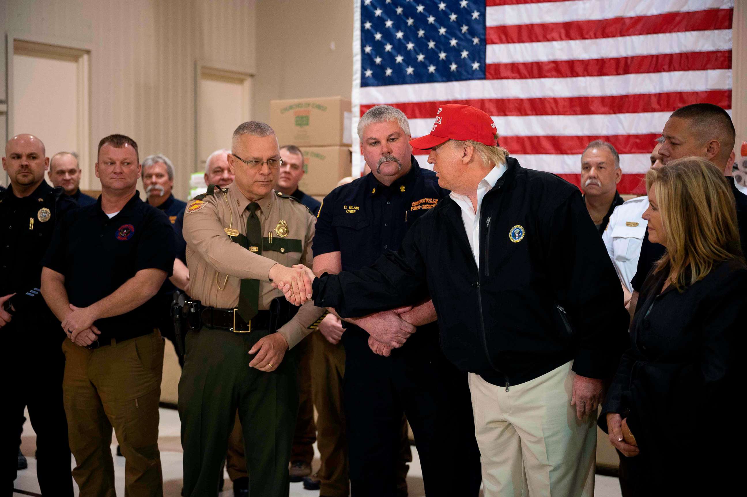 PHOTO: President Donald Trump greets first responders at the Jefferson Avenue Church of Christ disaster relief distribution center after touring tornado damage in Cookeville, Tenn.,  on March 6, 2020.