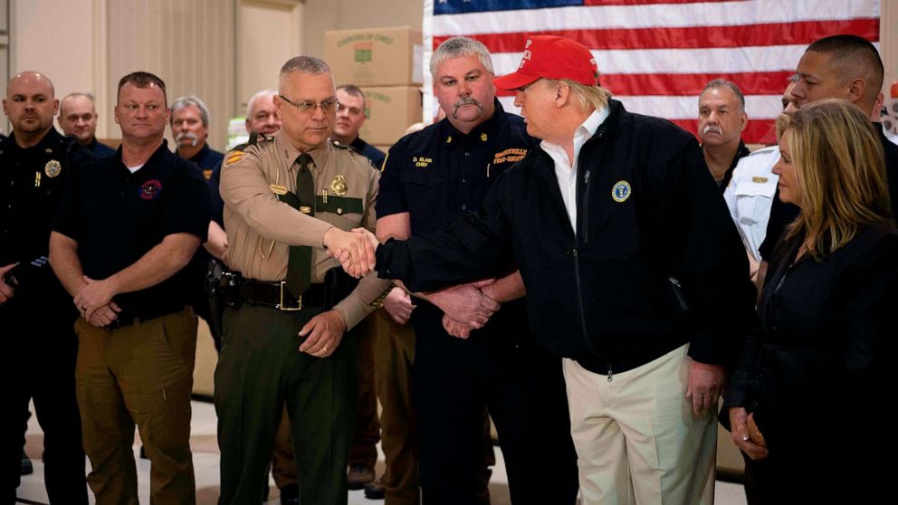PHOTO: President Donald Trump greets first responders at the Jefferson Avenue Church of Christ disaster relief distribution center after touring tornado damage in Cookeville, Tenn.,  on March 6, 2020.