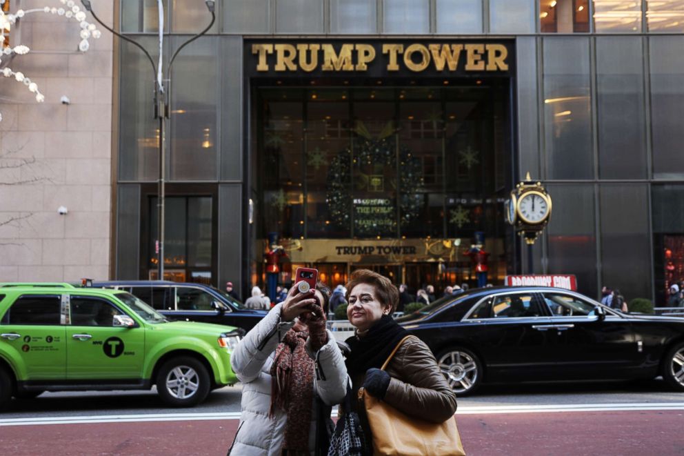 PHOTO: People walk by Trump Tower in midtown Manhattan on Dec. 10, 2018, in New York.