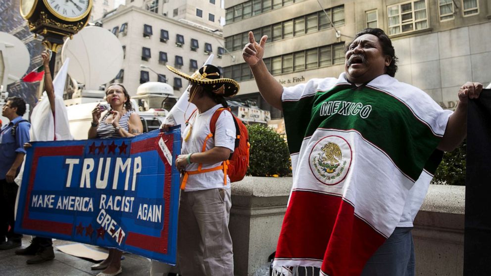Photo: In this file photo from September 3, 2015, demonstrators stand outside Trump Tower in New York to protest Donald Trump's candidacy for president of the United States.