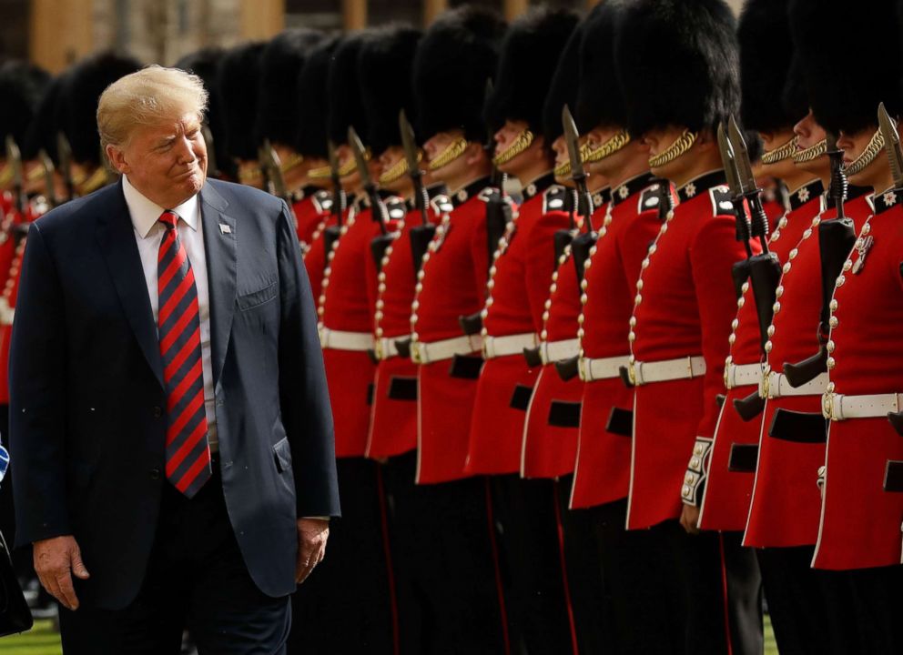 PHOTO: President Donald Trump inspects the guard of honour formed of the Coldstream Guards during a welcome ceremony at Windsor Castle on July 13, 2018 with Britain's Queen Elizabeth II on the second day of Trump's U.K. visit.