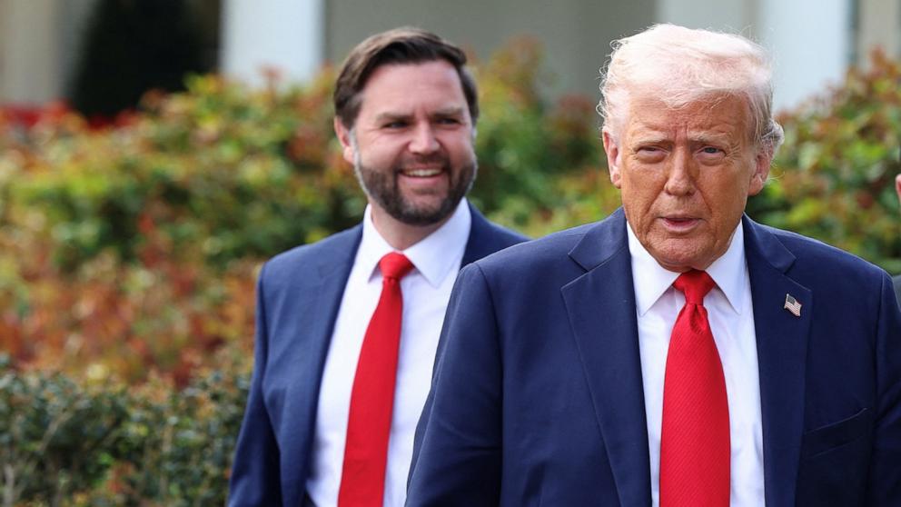 PHOTO: President Donald Trump and Vice President JD Vance walk to welcome the Ohio State University 2025 College Football National Champions, at the White House, in Washington, D.C., April 14, 2025.