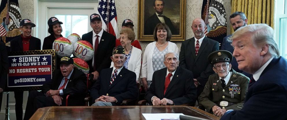 PHOTO: President Donald Trump meets with World War II veterans (L-R) Sidney Walton, Allen Jones, Paul Kriner and Floyd Wigfield in the Oval Office of the White House April 11, 2019 in Washington, DC.