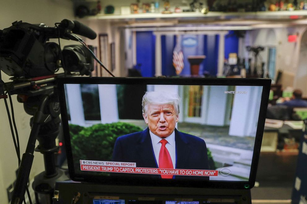 PHOTO: President Donald Trump speaks during a recorded video on a television screen in the press briefing room at the White House on Jan. 6, 2021, during the siege of the U.S. Capitol.
