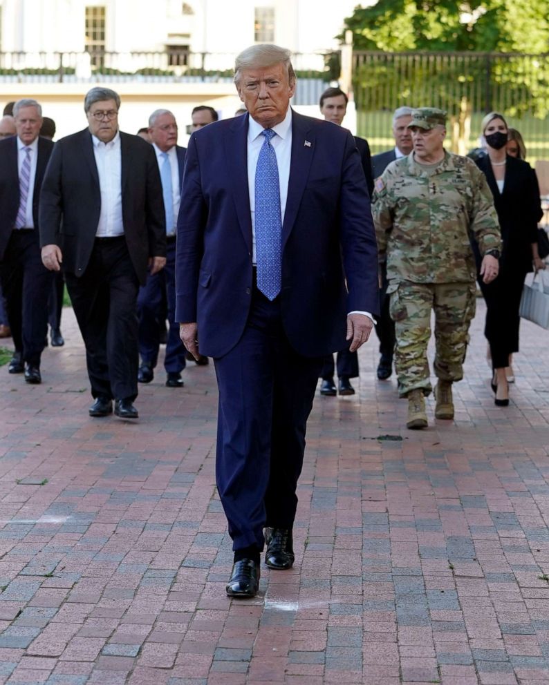 PHOTO: President Donald Trump is trailed by Gen. Mark Milley, the chairman of the Joint Chiefs of Staff, and other officials as he walks to St. John's Episcopal Church from the White House on June, 1, 2020.