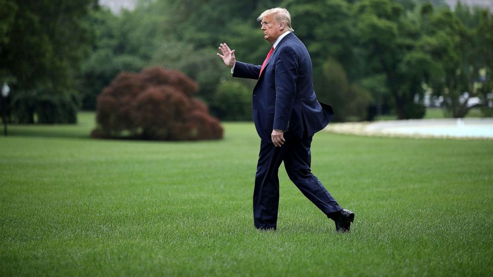 PHOTO: President Donald Trump walks across the South Lawn before boarding Marine One and departing the White House June 05, 2020, in Washington, DC.