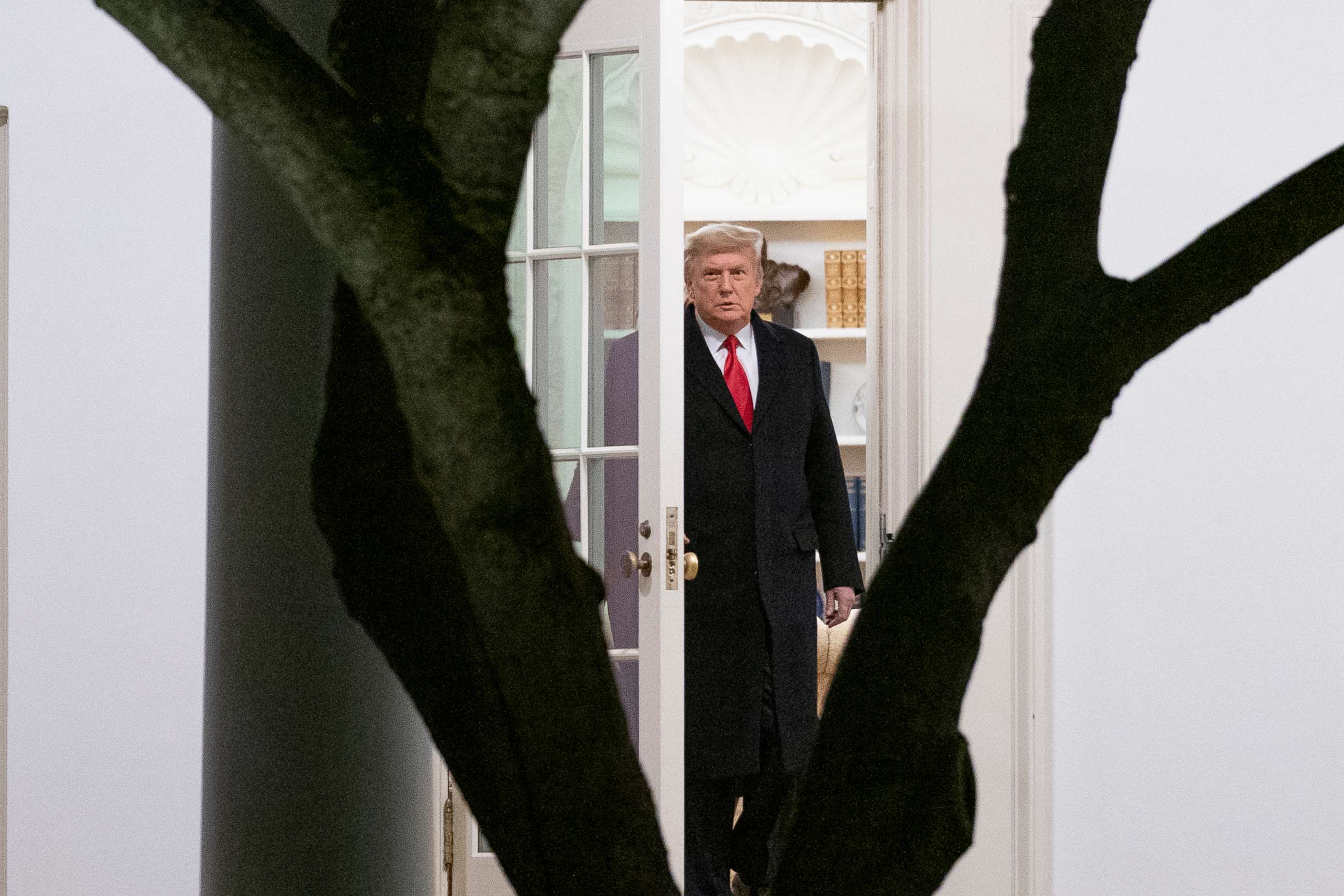 PHOTO: President Donald Trump walks out of the Oval Office to board Marine One on the South Lawn of the White House in Washington, Jan. 4, 2021, for a short trip to Andrews Air Force Base, Md., and then on to Dalton, Ga.