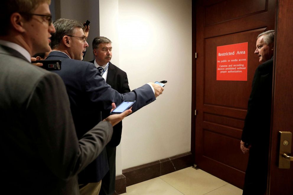 PHOTO: Congressman Mark Meadows looks at reporters as he enters a secure area as Deputy Assistant Secretary of Defense Laura Cooper testifies as part of the impeachment inquiry into President Donald Trump on Capitol Hill in Washington, Oct. 23, 2019.