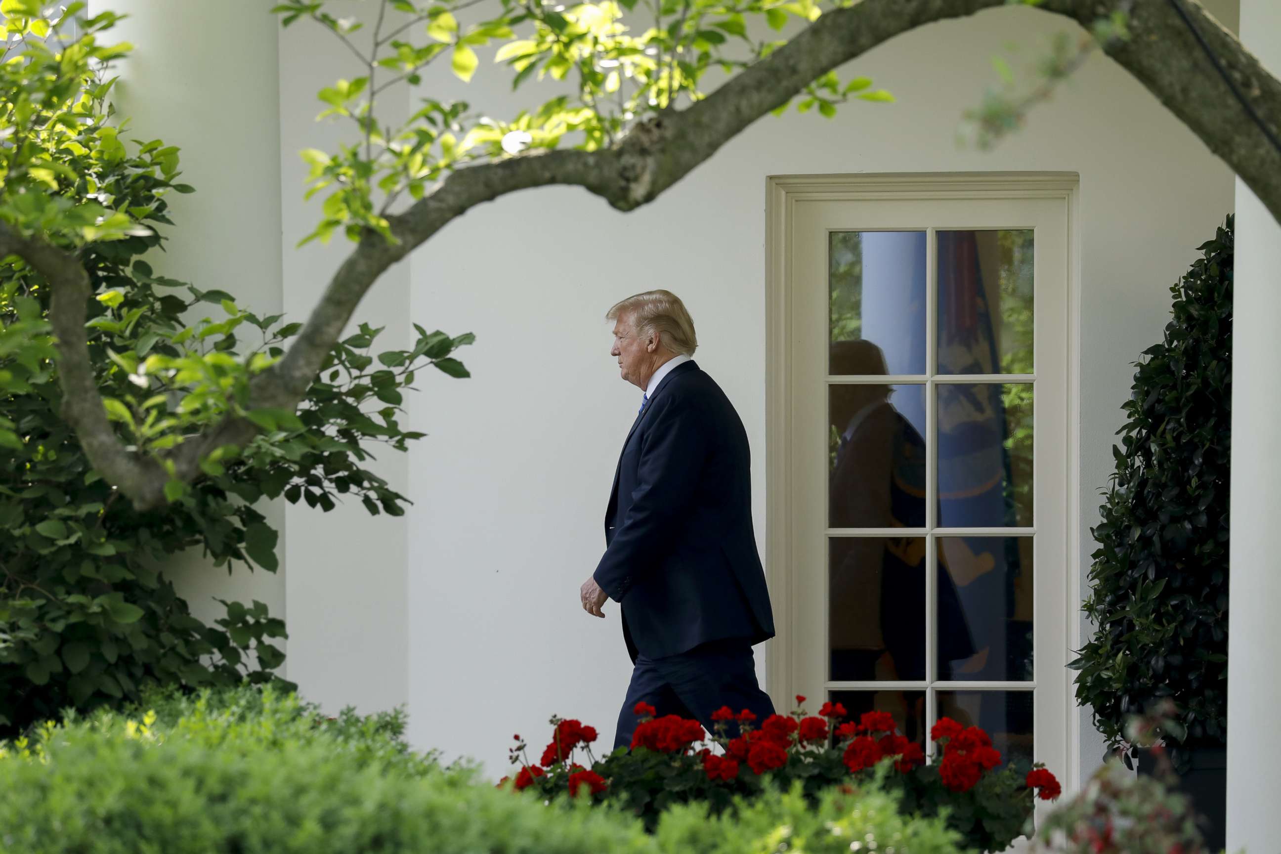 PHOTO: Donald Trump walks out of the Oval Office of the White House before boarding Marine One in Washington, May 14, 2018.