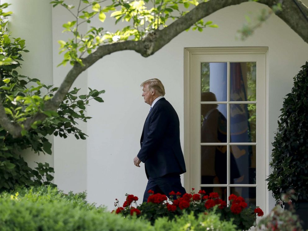PHOTO: Donald Trump walks out of the Oval Office of the White House before boarding Marine One in Washington, May 14, 2018.