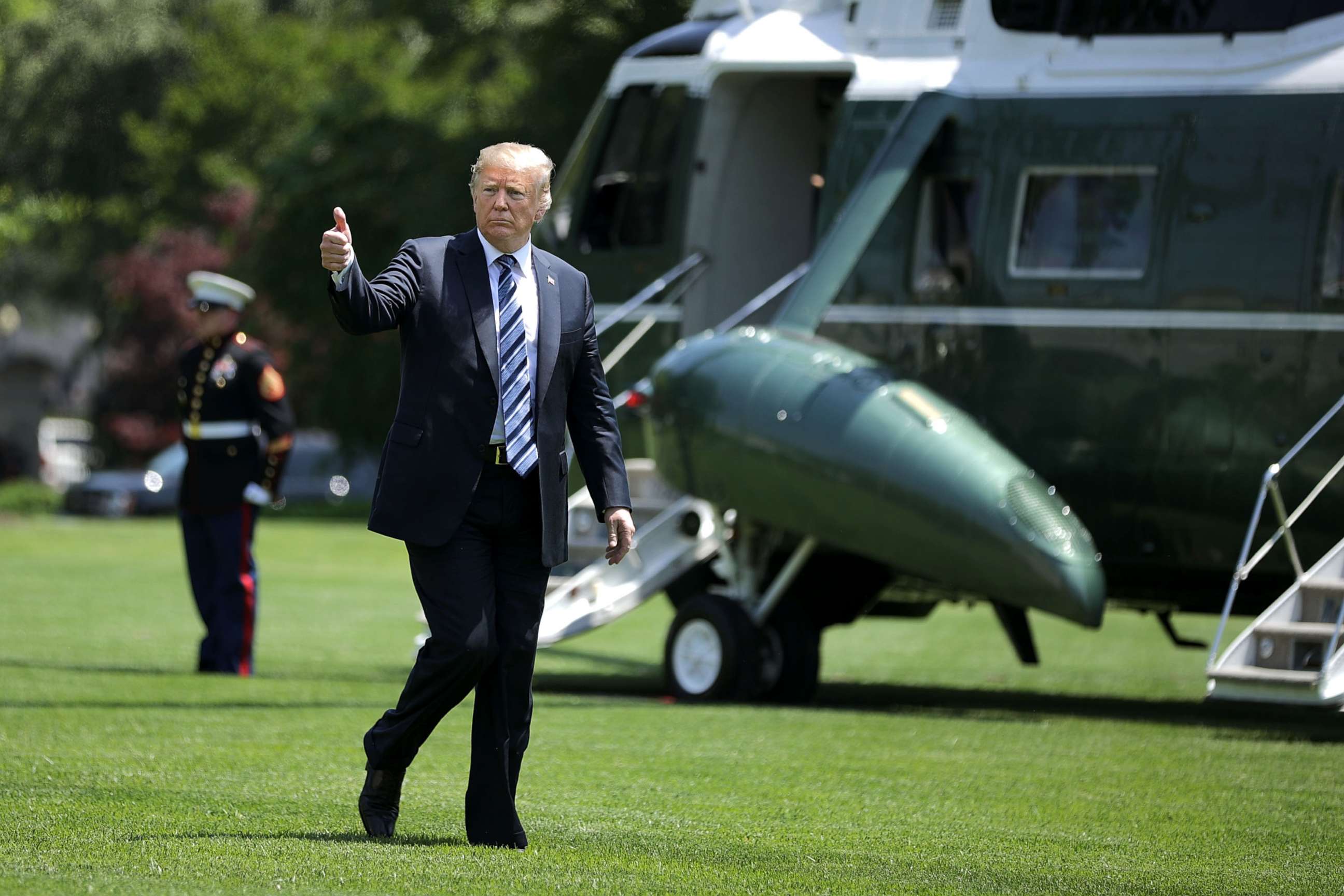 PHOTO: President Donald Trump gives a thumbs up as he walks across the South Lawn after returning to the White House on May 25, 2018, in Washington, D.C. Trump delivered remarks at the U.S. Naval Academy graduation ceremony in Annapolis, Maryland. 