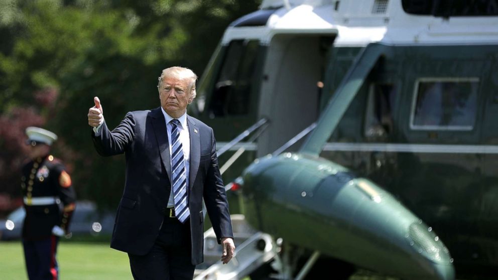 President Donald Trump gives a thumbs up as he walks across the South Lawn after returning to the White House on May 25, 2018, in Washington, D.C. Trump delivered remarks at the U.S. Naval Academy graduation ceremony in Annapolis, Maryland.