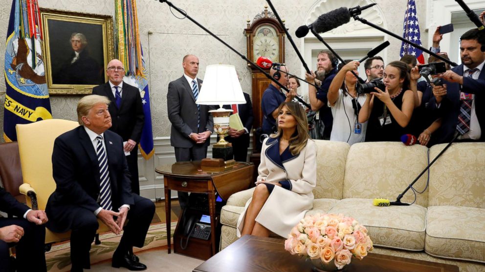 PHOTO: President Donald Trump listens to questions as he sits with first lady Melania Trump during a meeting with Poland's President Andrzej Duda in the Oval Office, Sept. 18, 2018.
