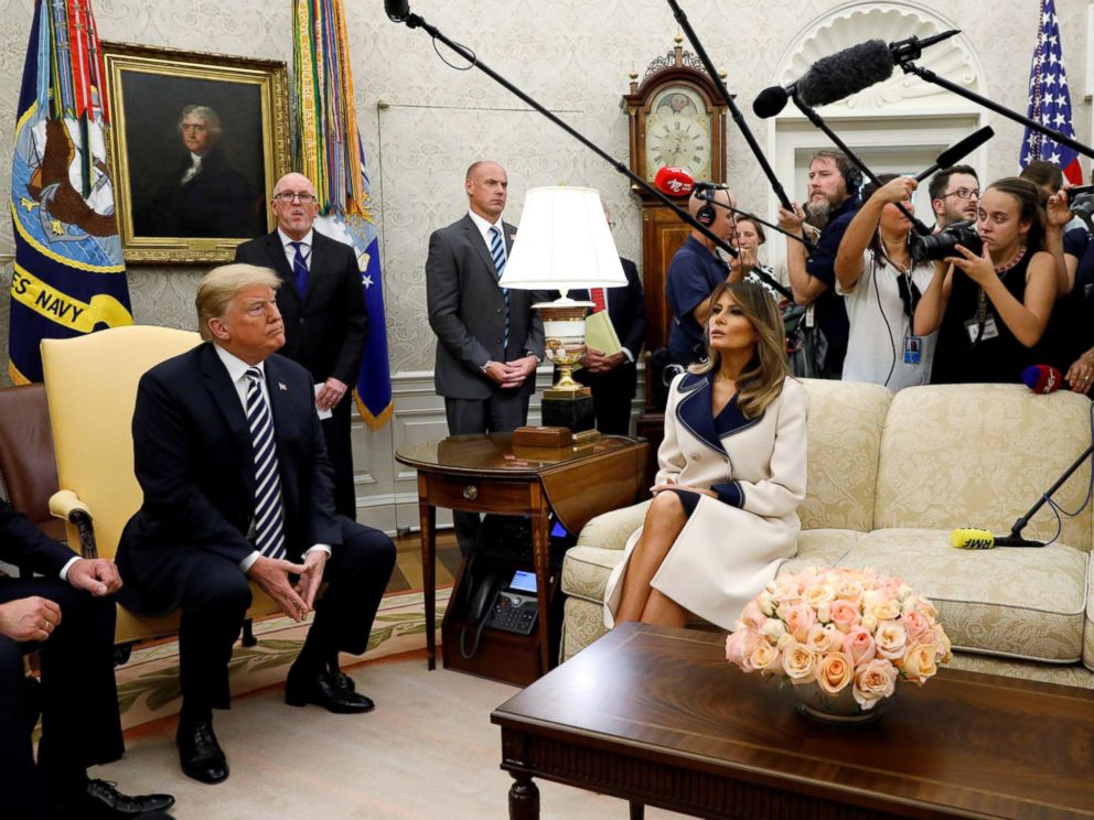 PHOTO: President Donald Trump listens to questions as he sits with first lady Melania Trump during a meeting with Polands President Andrzej Duda in the Oval Office, Sept. 18, 2018.