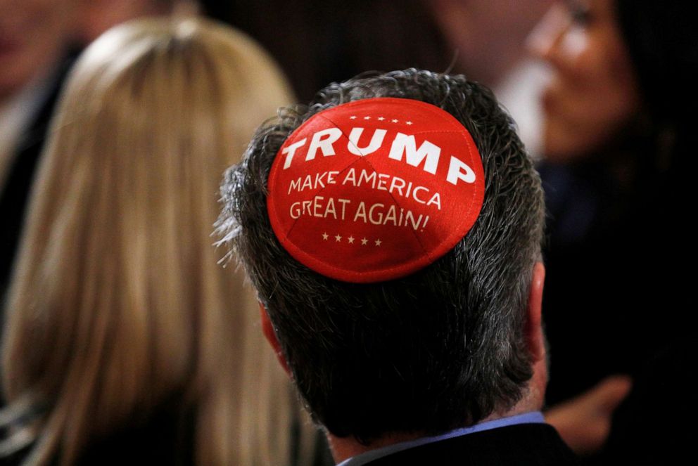 PHOTO: A participant wears a Trump "Make America Great Again" yarmulke as they attend a Hanukkah reception where President Donald Trump signed an executive order on anti-semitism in the East Room of the White House in Washington, Dec. 11, 2019.