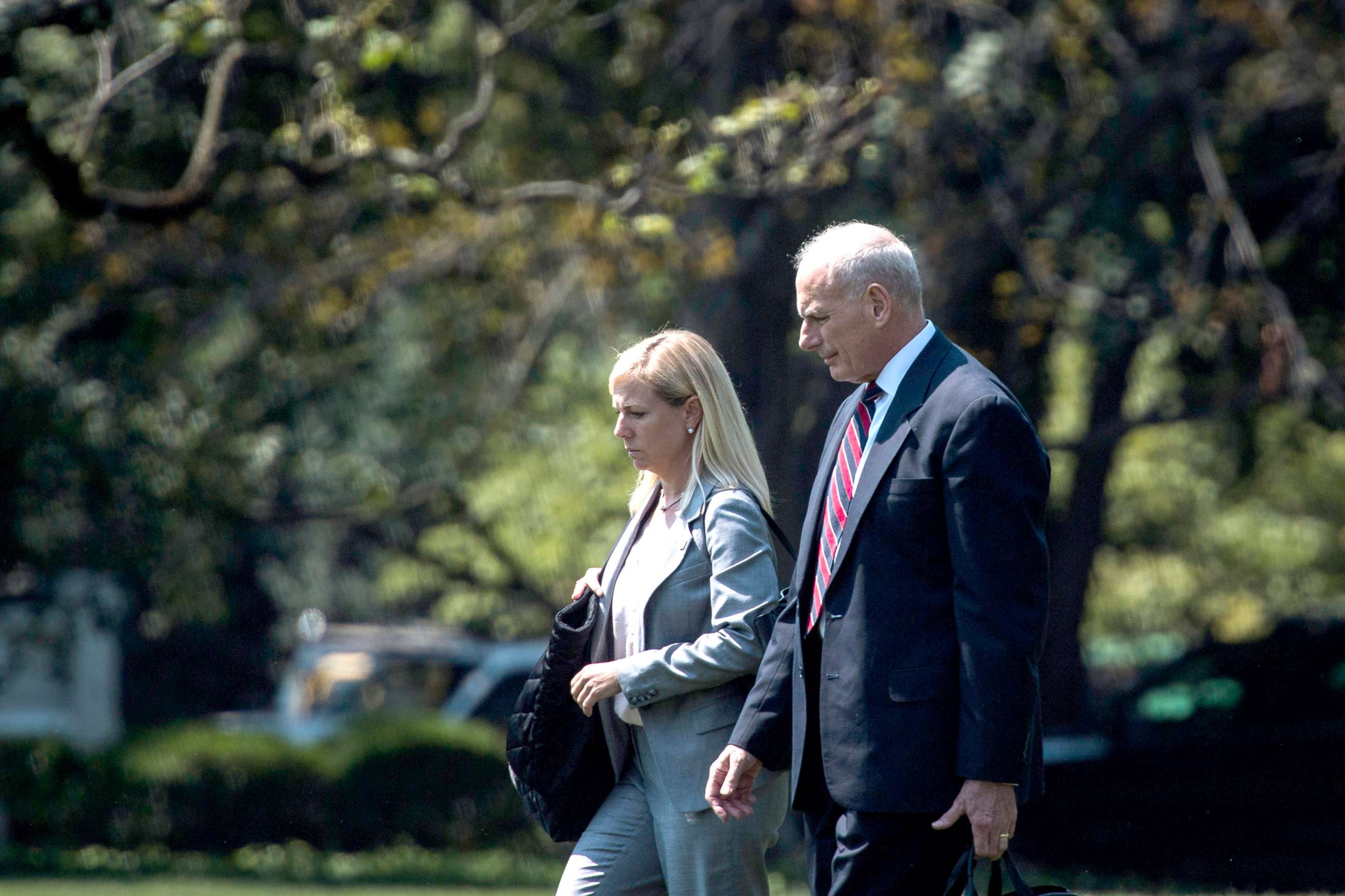 PHOTO: DHS Secretary Kirstjen Nielsen walks with White House chief of staff John Kelly across the South Lawn to board Marine One for a trip with President Donald Trump to Yuma, Ariz. to visit the U.S. border with Mexico, Aug 22, 2017. 