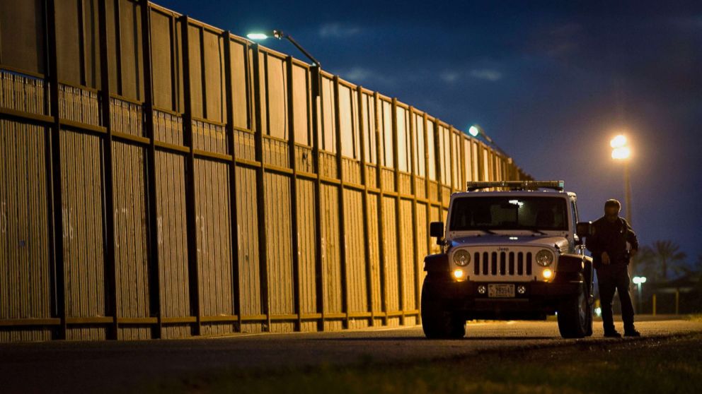 PHOTO: A U.S. Border Patrol agents stands outside his vehicle next to the U.S.-Mexico border fence in San Diego, Calif.,Feb. 26, 2015.