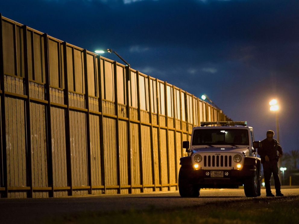 PHOTO: A U.S. Border Patrol agents stands outside his vehicle next to the U.S.-Mexico border fence in San Diego, Calif.,Feb. 26, 2015.