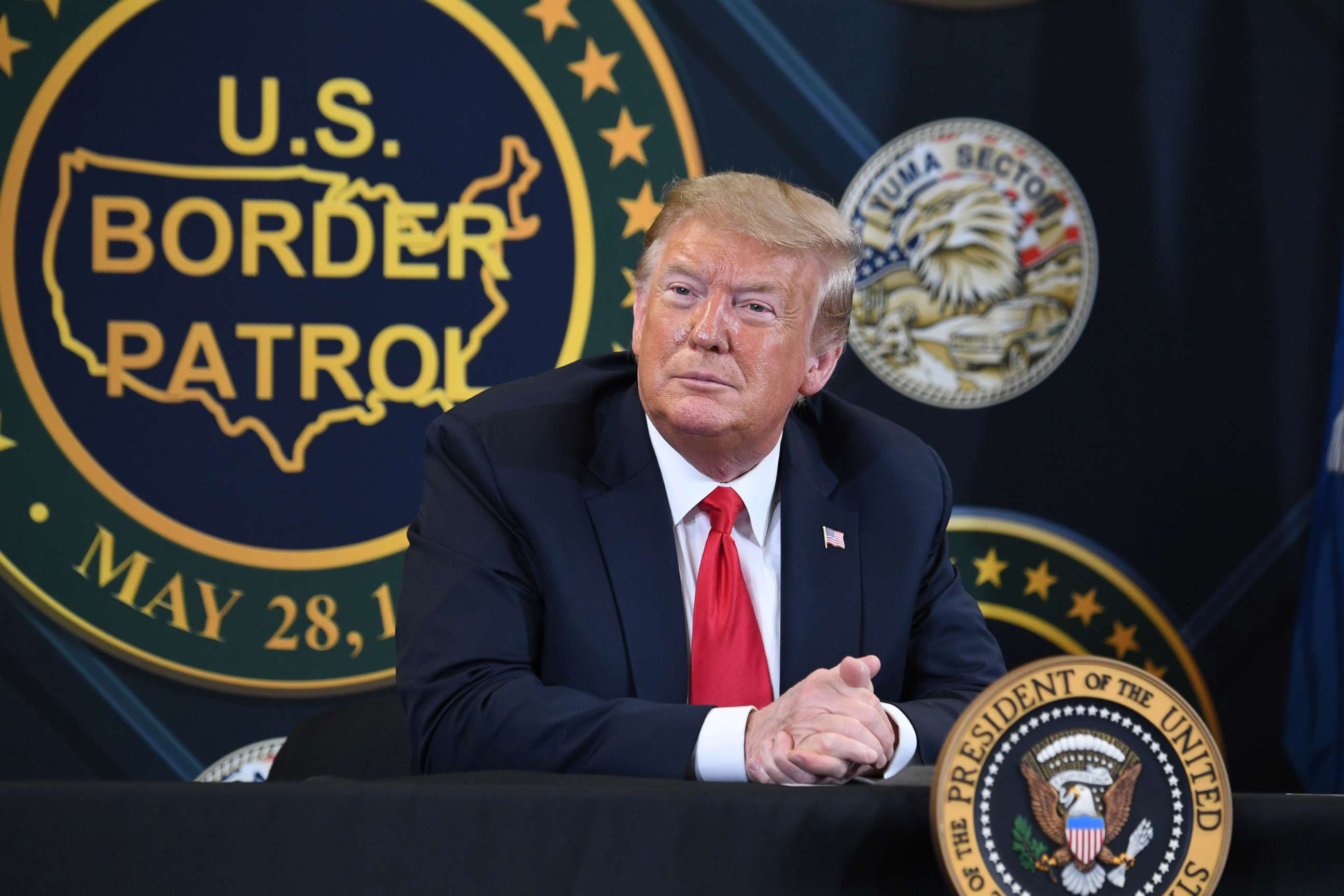 PHOTO: President Donald Trump looks on during a roundtable briefing on border security at the United States Border Patrol Yuma Station in Yuma, AZ., June 23, 2020.
