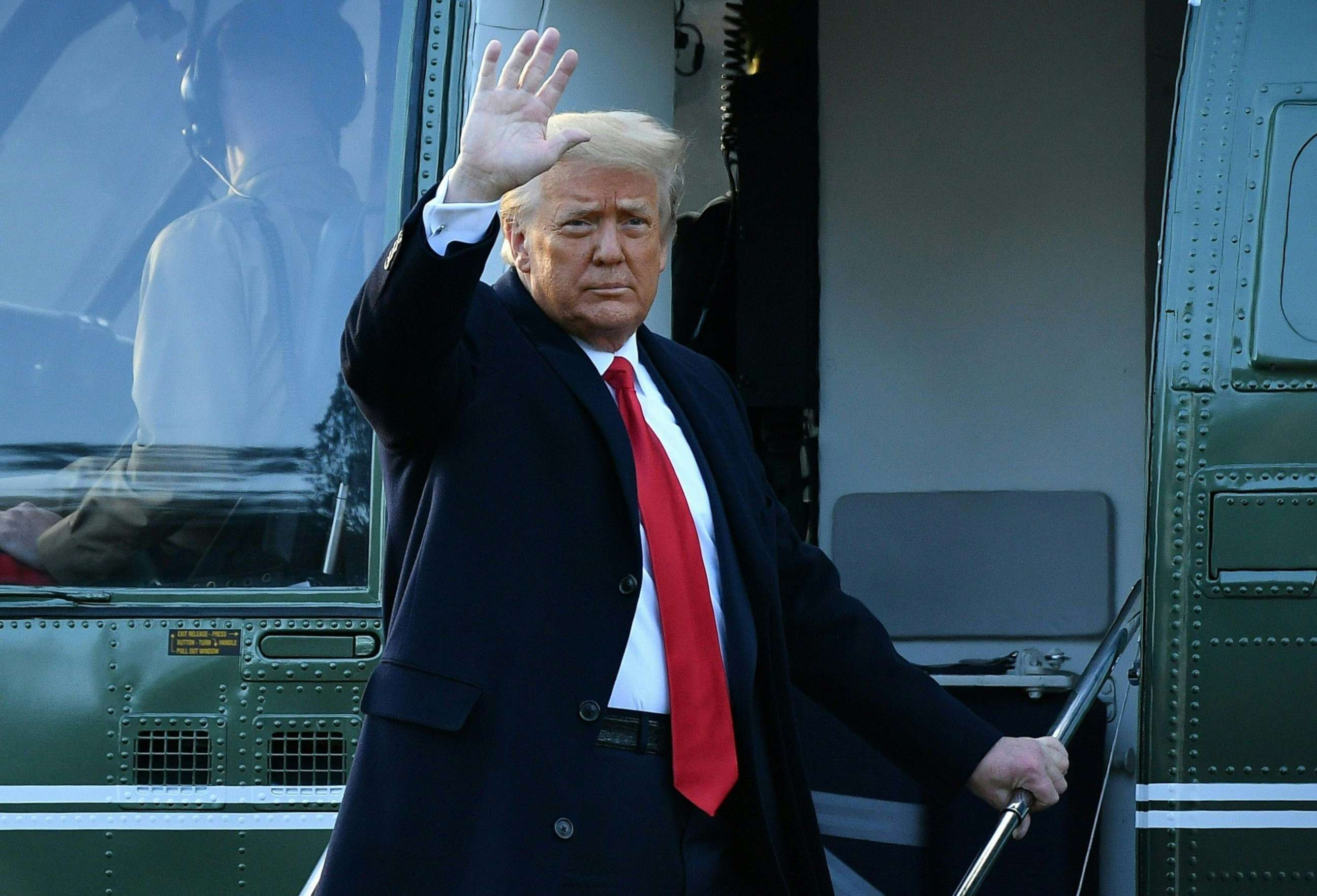 PHOTO: Outgoing President Donald Trump waves as he boards Marine One at the White House in Washington, D.C, Jan. 20, 2021.
