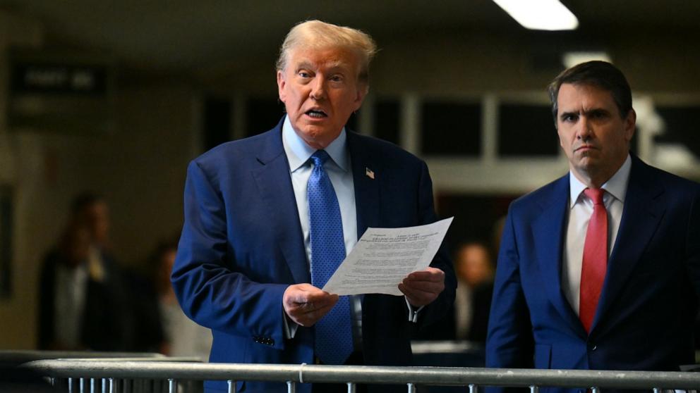 PHOTO: Former President Donald Trump speaks to the media with attorney Todd Blanche as he attends his trial at Manhattan Criminal Court on May 9, 2024 in New York City.