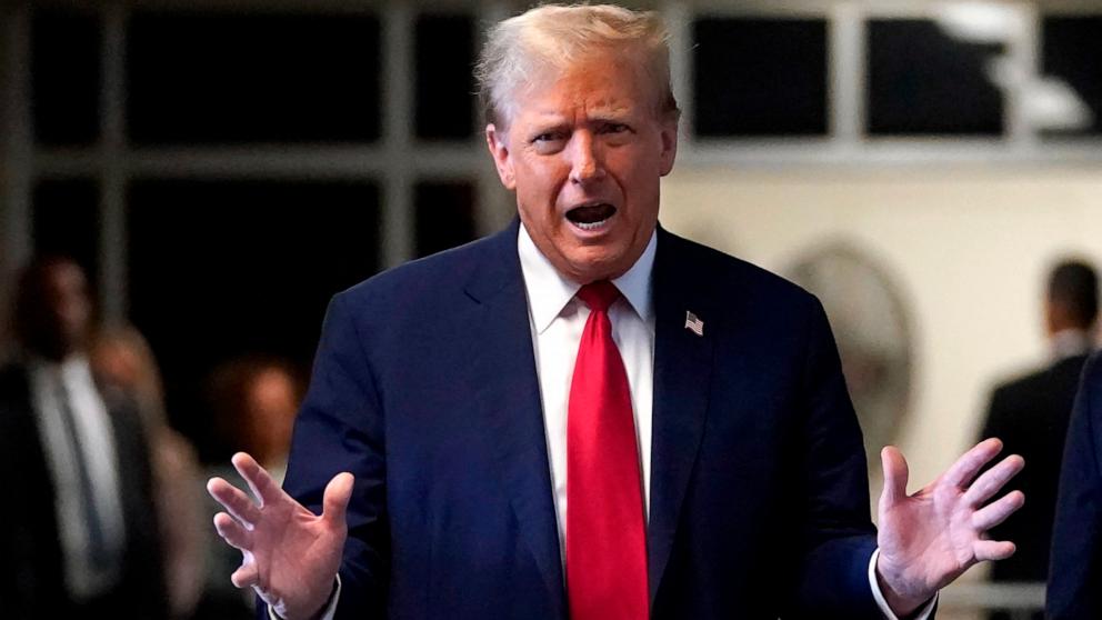 PHOTO: Former President Donald Trump speaks to the press as he arrives at his trial at Manhattan Criminal Court in New York City on April 23, 2024.