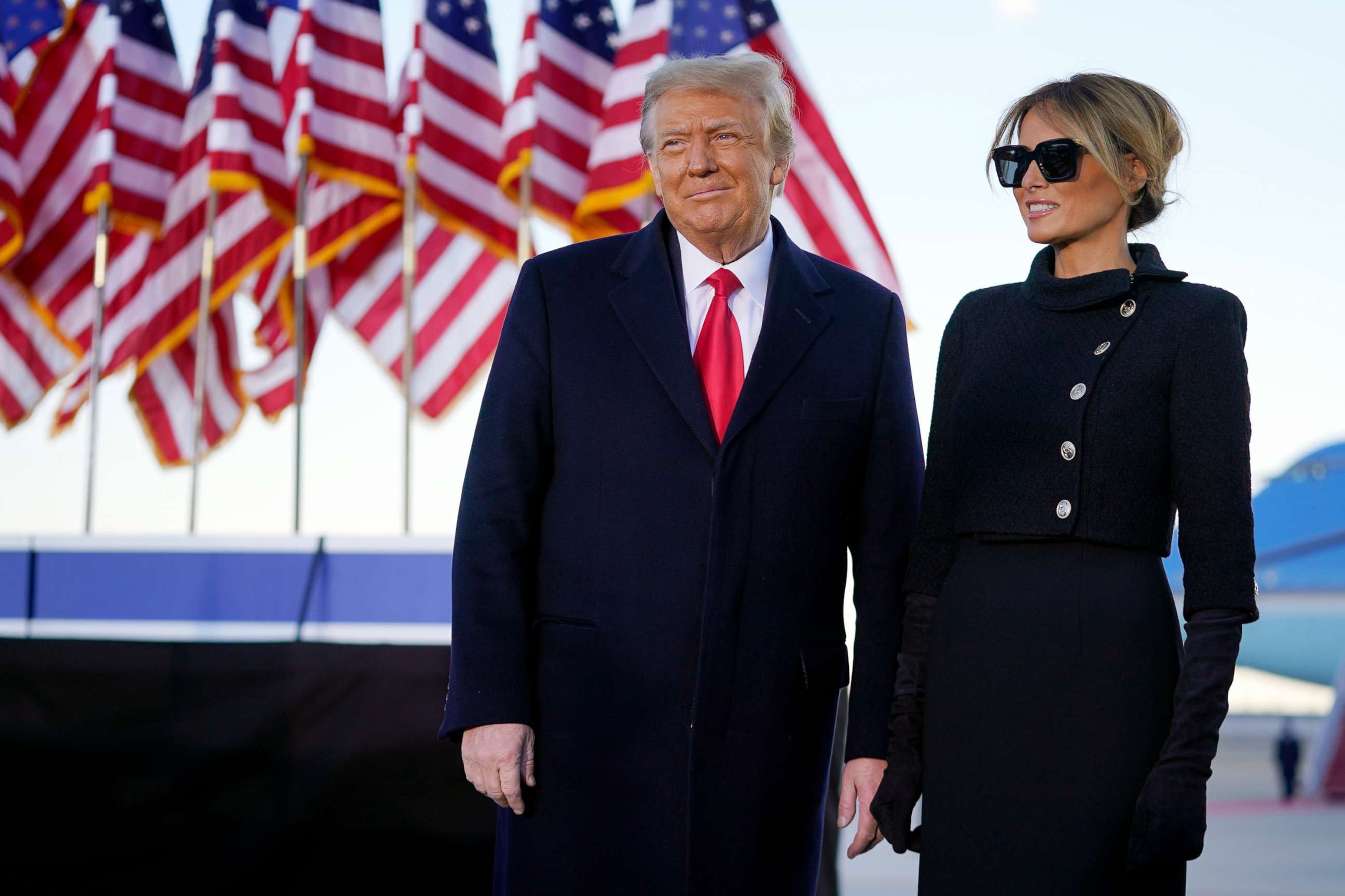 PHOTO: President Donald Trump and first lady Melania Trump look at supporters before boarding Air Force One at Andrews Air Force Base, Md., Jan. 20, 2021.