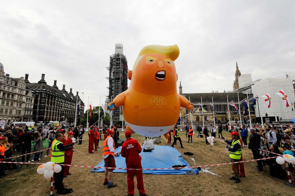 PHOTO: Anti-Trump demonstrators inflate a giant balloon depicting U.S. President Donald Trump as an orange baby in Parliament Square in London on June 4, 2019.