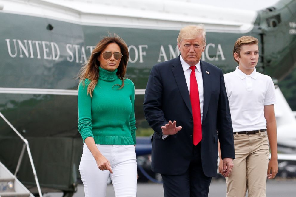 PHOTO: U.S. President Donald Trump walks from Marine One to board Air Force One with First Lady Melania Trump and their son Barron in Morristown, New Jersey, Aug. 19, 2018.