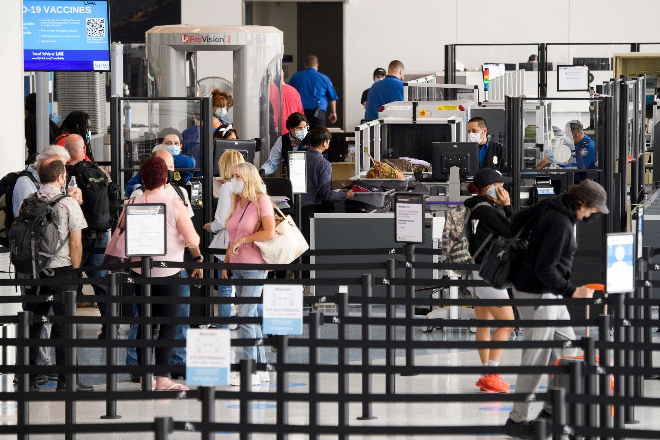 PHOTO: Travelers enter a new Transportation Security Administration (TSA) screening area during the opening of the Terminal 1 expansion at Los Angeles International Airport, June 4, 2021.