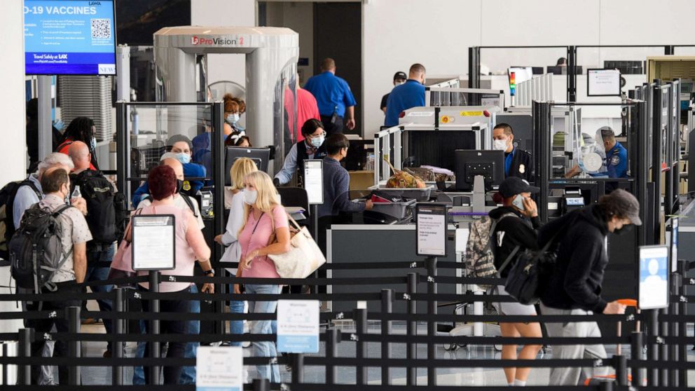 PHOTO: Travelers enter a new Transportation Security Administration (TSA) screening area during the opening of the Terminal 1 expansion at Los Angeles International Airport, June 4, 2021.