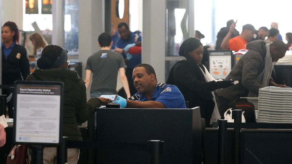  TSA employees, who are currently working without pay, screen passengers during the partial shutdown of the U.S. government, at Baltimore Washington International Thurgood Marshall Airport, on Jan. 14, 2019 in Baltimore. 
							