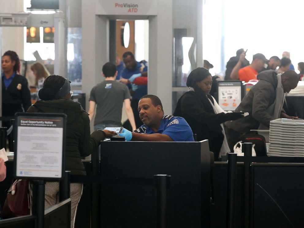 PHOTO: TSA employees, who are currently working without pay, screen passengers during the partial shutdown of the U.S. government, at Baltimore Washington International Thurgood Marshall Airport, on Jan. 14, 2019 in Baltimore.