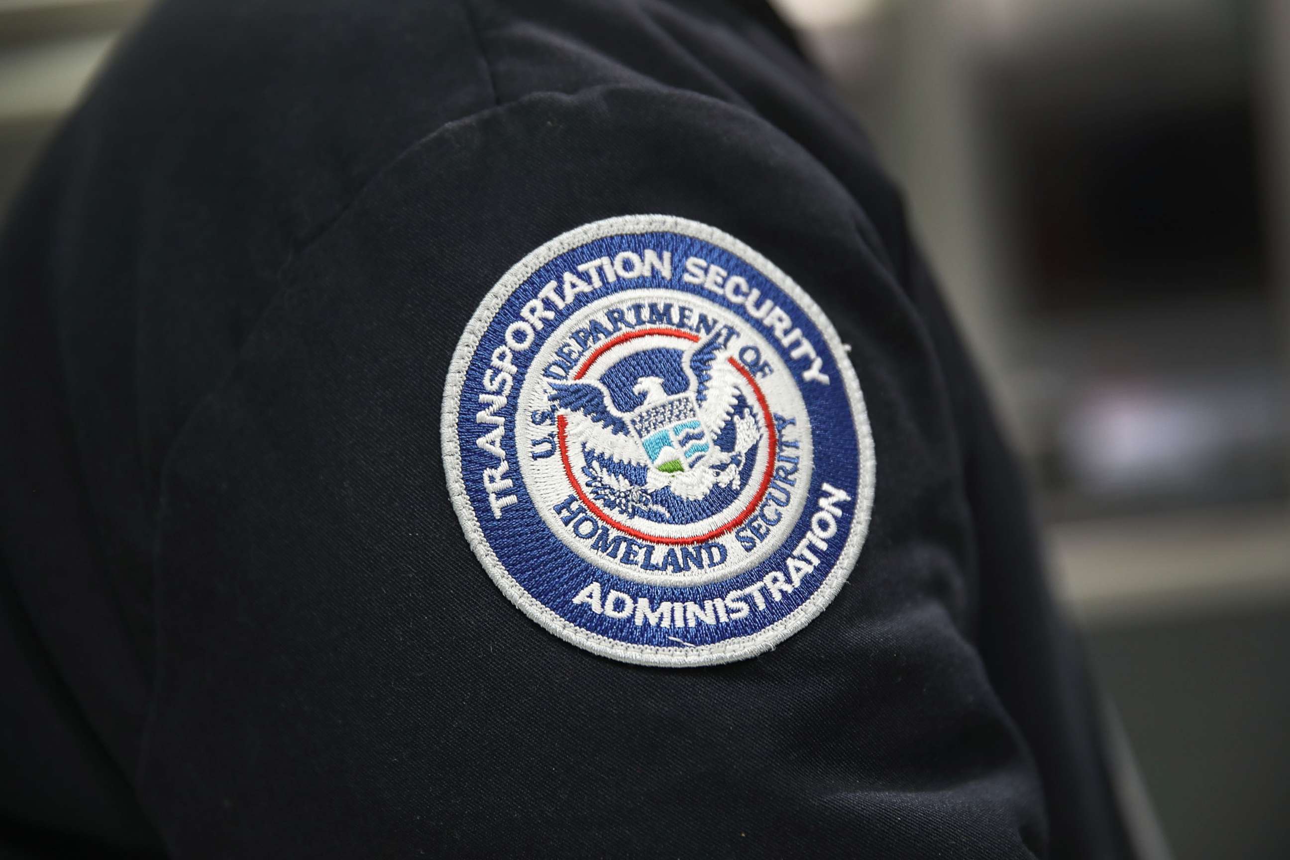 PHOTO: A Transportation Security Administration official works at the automated screening lanes at Miami International Airport, Oct. 24, 2017, in Miami.