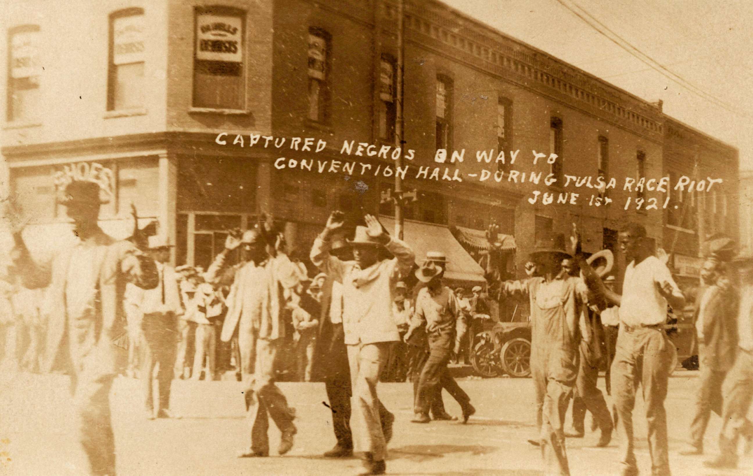 PHOTO: A group of Black men are marched past the corner of 2nd and Main Streets under armed guard during the Tulsa Race Massacre in Tulsa, Okla., on June 1, 1921.