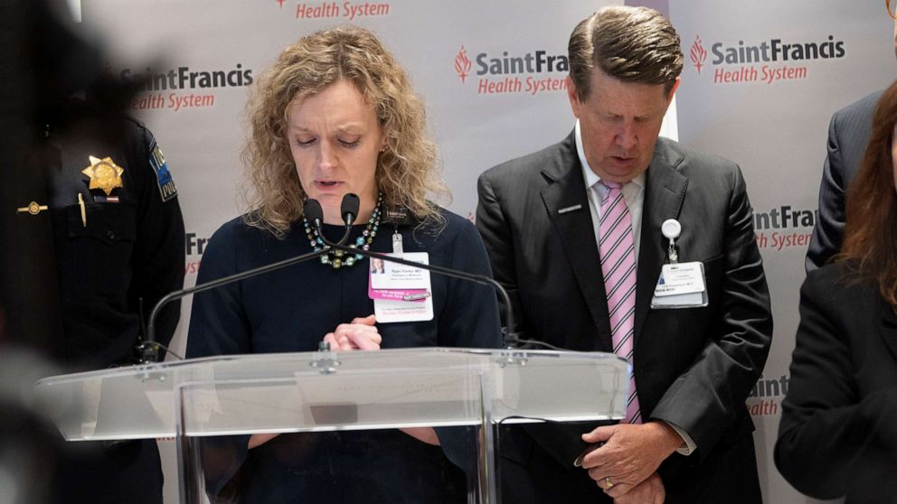 PHOTO: Associate Chief Medical Officer Ryan Parker and Saint Francis Hospital CEO Cliff Robertson react during a press conference at Saint Francis Hospital on June 2, 2022 in Tulsa, Okla. 