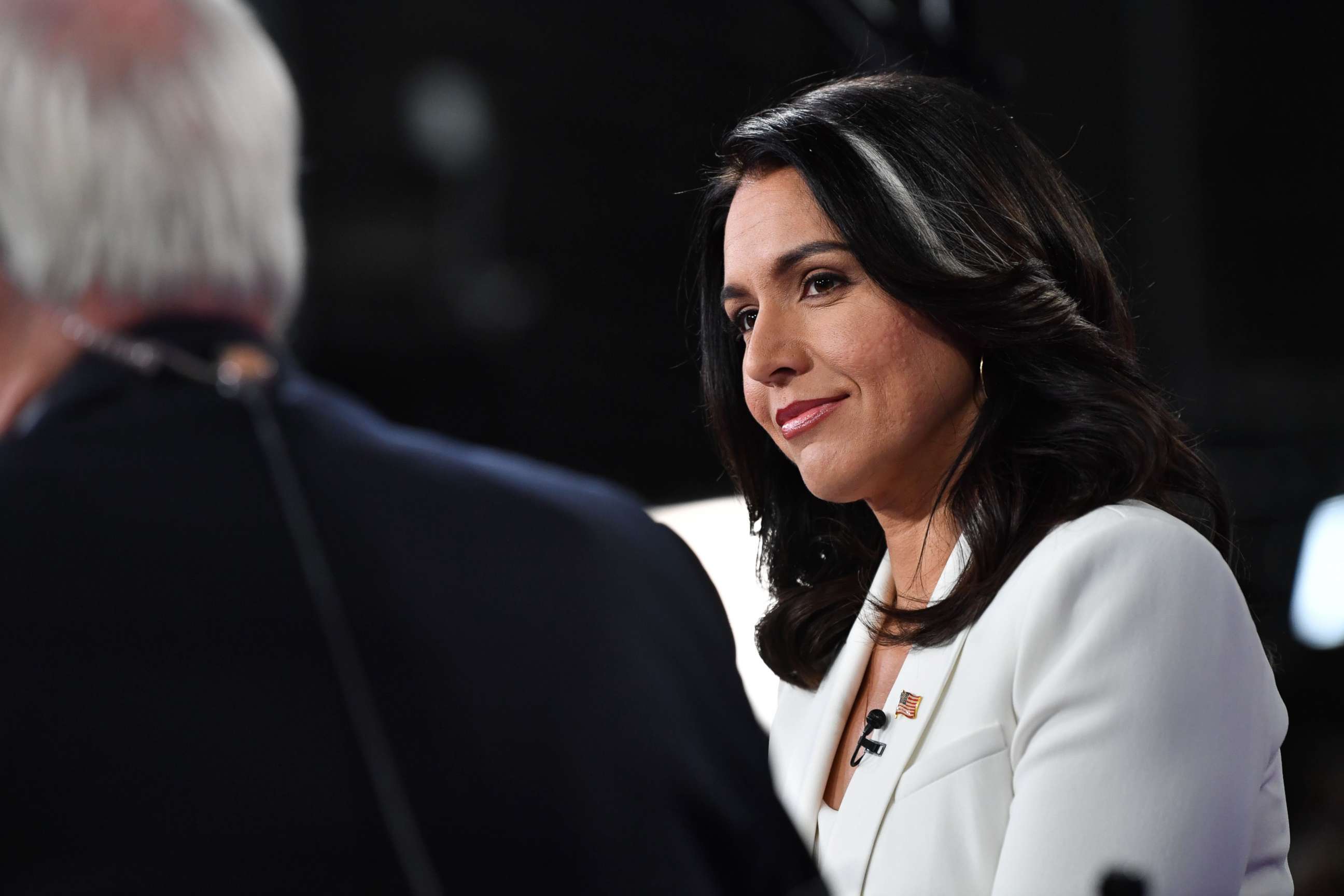 PHOTO: Democratic presidential hopeful Rep. Tulsi Gabbard speaks to the press in the Spin Room following the fifth Democratic primary debate at Tyler Perry Studios in Atlanta, Nov. 20, 2019.
