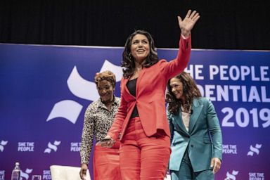 PHOTO: Democratic presidential candidate Rep. Tulsi Gabbard (D-HI) waves to a crowd at the She The People Presidential Forum, April 24, 2019, in Houston, Texas.