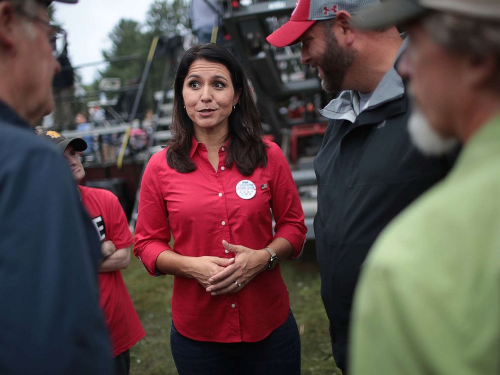 PHOTO: Democratic presidential candidate and Hawaii congresswoman Tulsi Gabbard greets guests at the Polk County Democrats Steak Fry, Sept. 21, 2019, in Des Moines, Iowa.