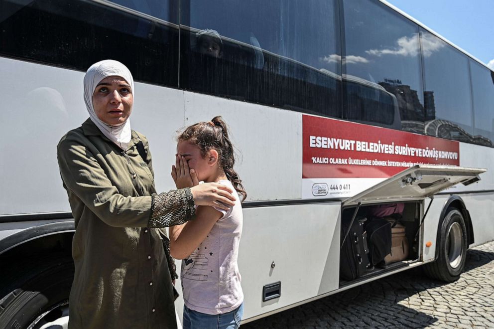 PHOTO: A Syrian refugee girl weeps as families board busses returning to neighbouring Syria on Aug. 6, 2019, in the Esenyurt district of Istanbul.